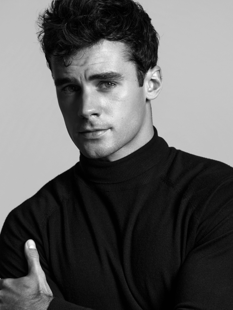 Jake_6BW_WEB Black and white profile portrait of male model Jake wearing a black turtleneck during a professional studio portfolio shoot